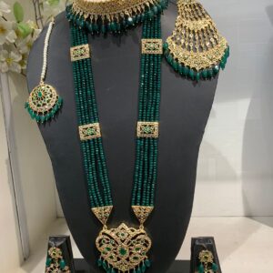 Elegant Green Stones Bridal Set on display