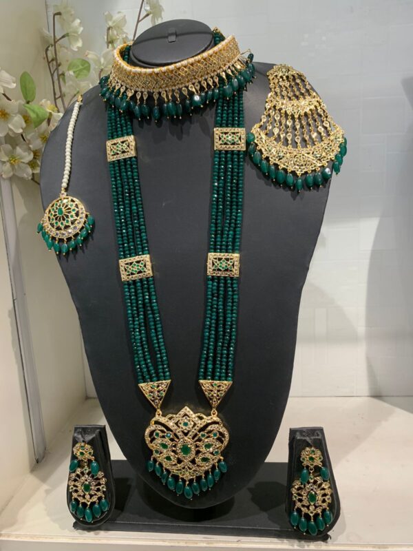 Elegant Green Stones Bridal Set on display