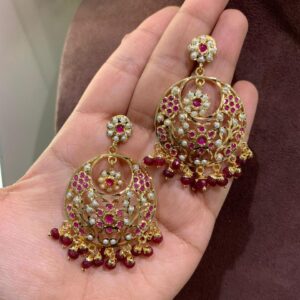 Exquisite Jadau Chandbali Earrings with intricate pearl and semi-precious stonework.